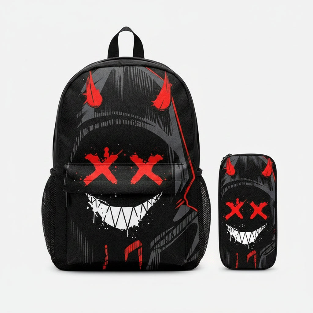 A black backpack and matching pencil case set featuring a stylized devil face graphic with red horns, red X eyes, and a wide grin with white teeth. The image includes a '2PCS' text overlay in the top right corner.