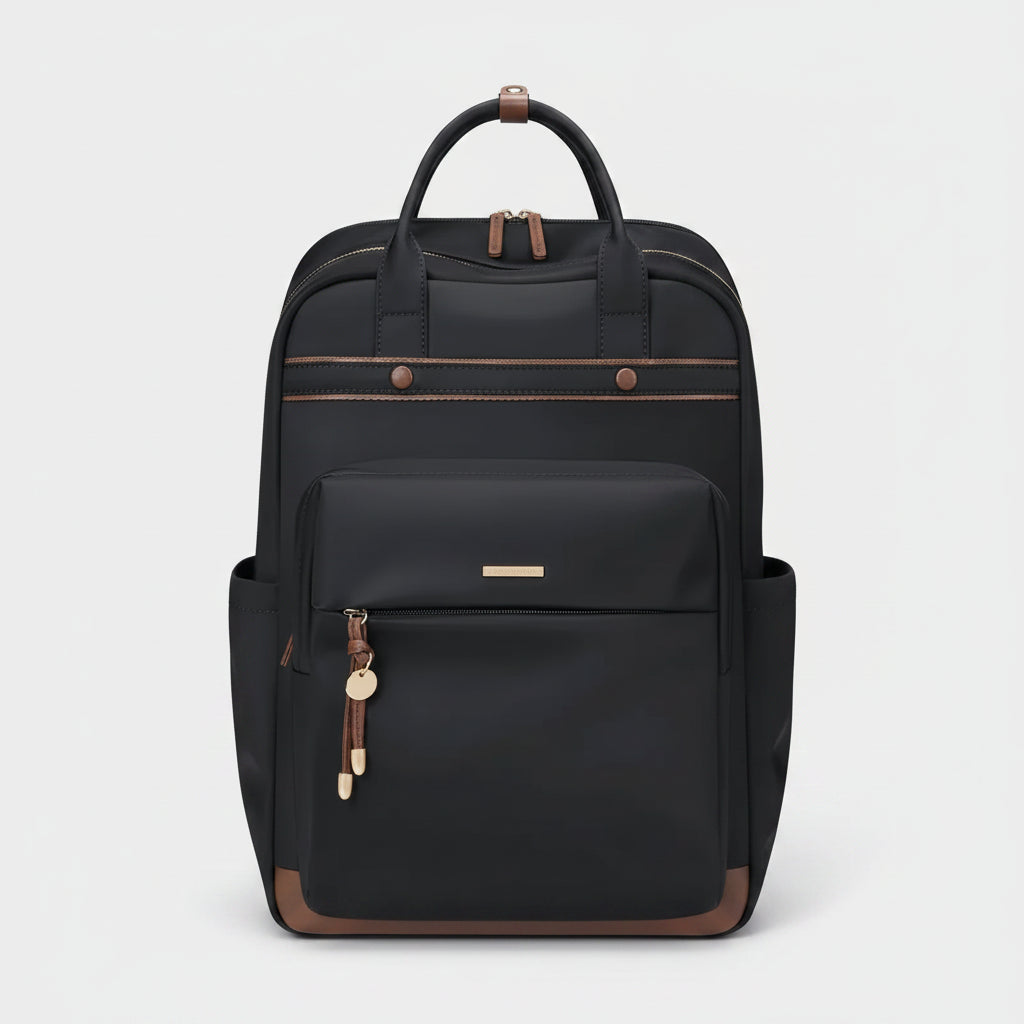 A black backpack with brown leather accents, featuring dual top handles, a front zippered pocket, side pockets, and a small gold-tone logo plate on a plain white background.