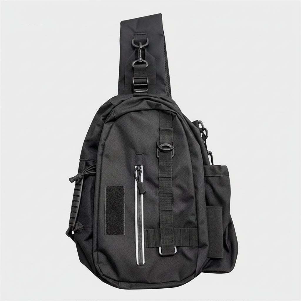 A black tactical sling backpack with multiple zippered pockets and adjustable straps, shown against a plain white background.