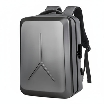 A dark gray hard-shell laptop backpack with a prominent Y-shaped logo on the front, black straps, and a side lockable compartment, shown on a plain white background.