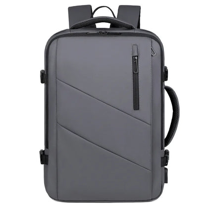 A gray and black laptop backpack with diagonal paneling on the front, a vertical zippered pocket, and padded shoulder straps, shown against a plain white background.