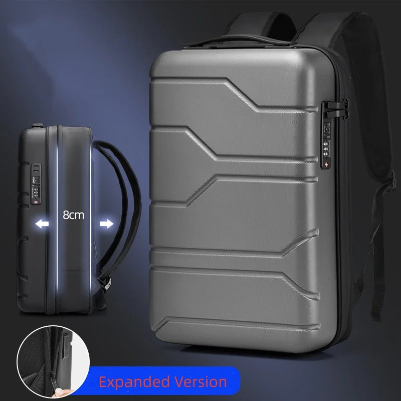 A gray hard-shell backpack shown with a side inset of a black version labeled 8cm, plus an inset circle showing the expanded version. The image includes text reading 'Expanded Version' and highlights the backpack's geometric shell design and side zipper.