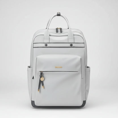 A light gray backpack with dual top handles, a front zippered pocket, side pockets, and small gold-tone hardware details, shown against a plain white background.