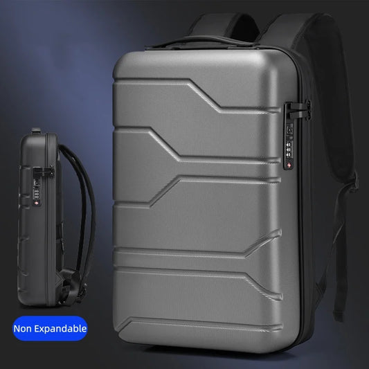 A metallic gray hard-shell laptop backpack shown from the front and side, with a small blue label reading 'Non Expandable' in the lower left corner.