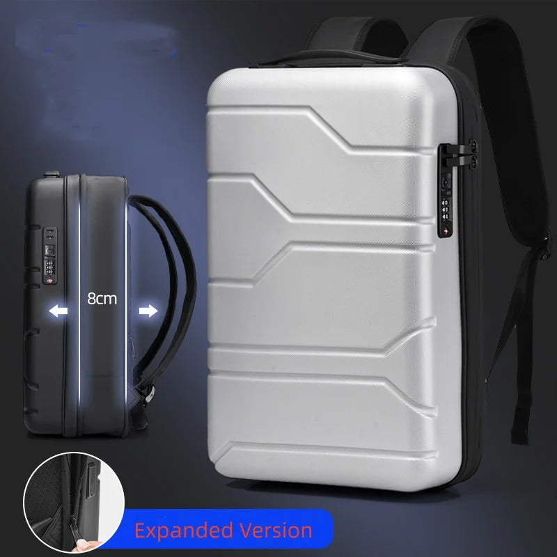 A silver and black hard-shell laptop backpack shown on a dark blue background, with a side inset showing a black version labeled 8cm depth and an 'Expanded Version' callout.