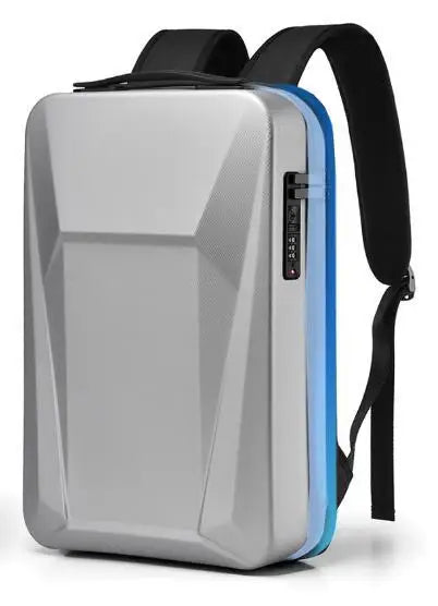 A silver hard-shell backpack with a geometric design, black shoulder straps, and a blue side accent, shown on a white background.