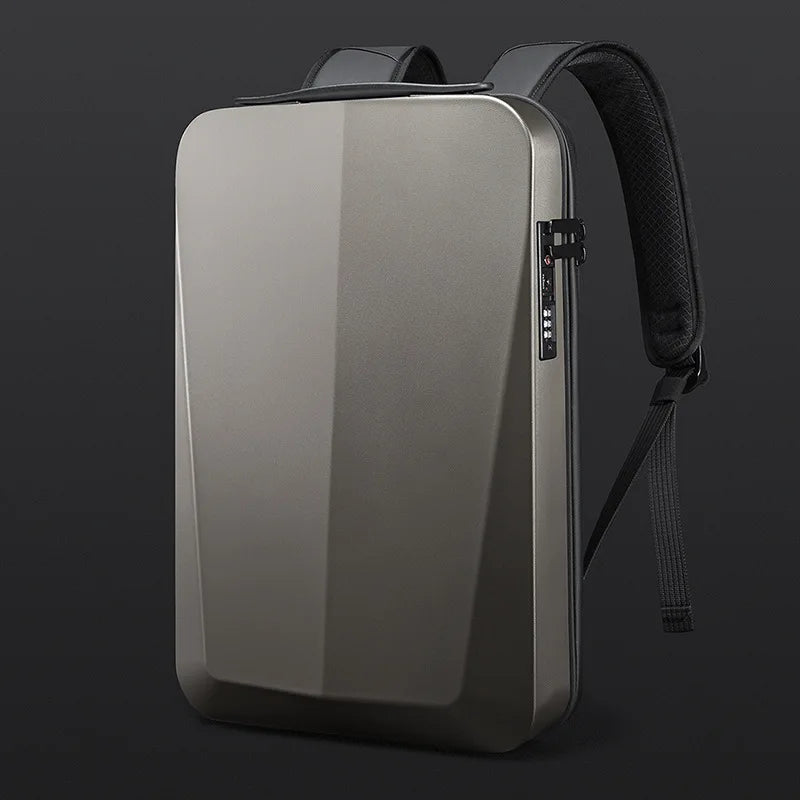 A sleek, metallic gray laptop backpack with a built-in laptop sleeve, shown on a dark studio background. The backpack features a matte metallic finish, a built-in laptop compartment, a combination lock, and padded black shoulder straps.