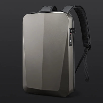 A sleek, metallic gray laptop backpack with a built-in laptop sleeve, shown on a dark studio background. The backpack features a matte metallic finish, a built-in laptop compartment, a combination lock, and padded black shoulder straps.