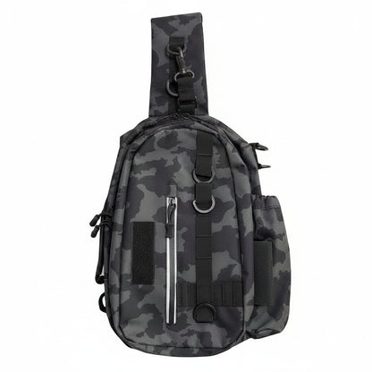 A tactical-style sling backpack in a dark gray and black camouflage pattern, featuring a wide shoulder strap, multiple zippered pockets, and webbing straps, shown against a plain white background.