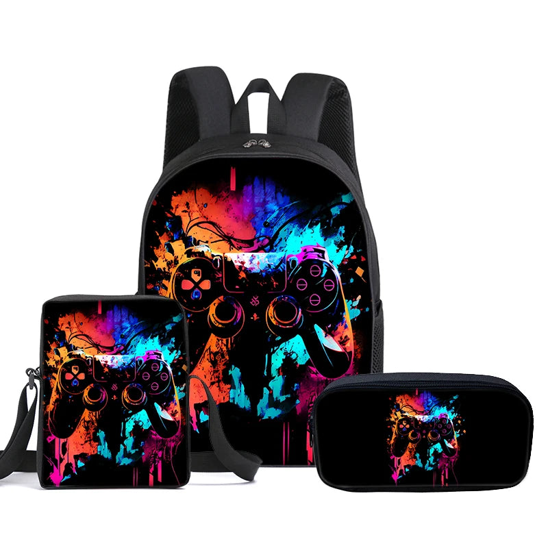 A three-piece gaming accessory set including a backpack, a small pouch, and a slim case, all featuring a black background with a vibrant, colorful graffiti-style graphic of a video game controller.