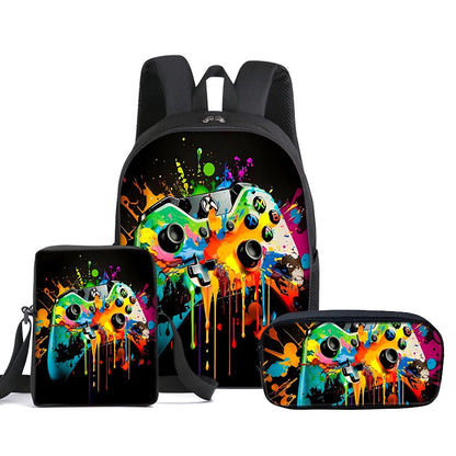 A three-piece gaming accessory set including a backpack, a small pouch, and a zippered case, all featuring a colorful neon paint splatter and drip design over a black background with a game controller motif.