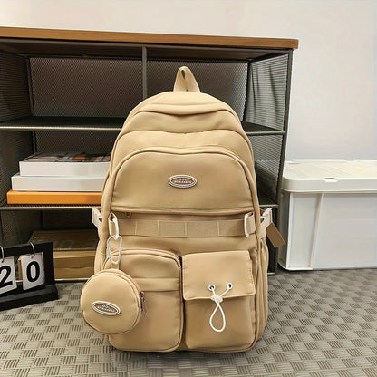 Beige backpack with a small round pouch on a checkered floor.