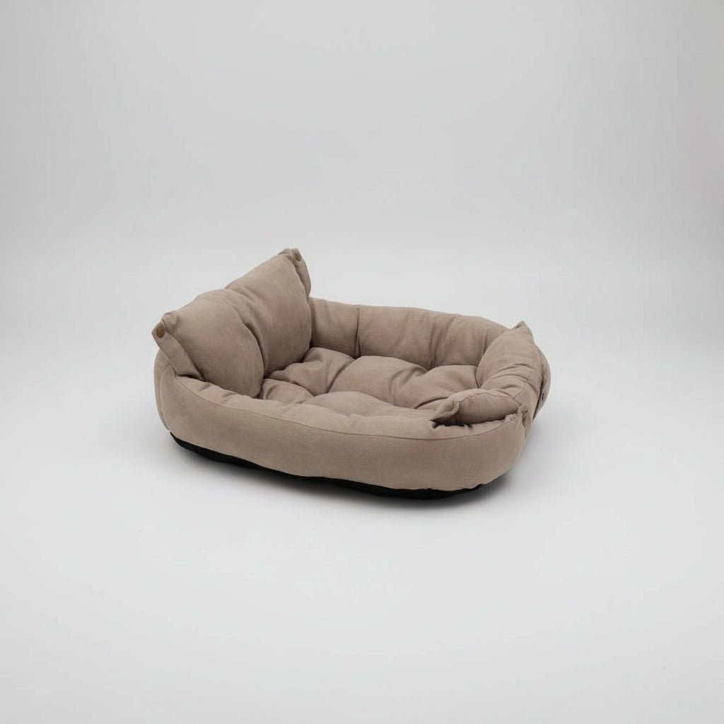 Beige pet bed on a white background