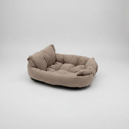 Beige pet bed on a white background
