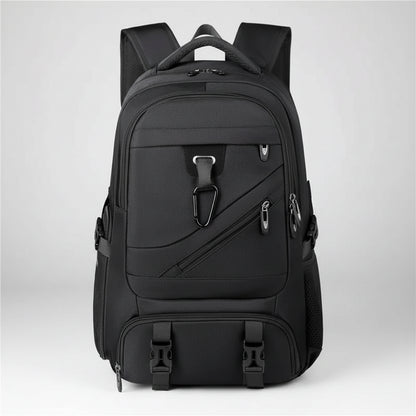 Black backpack with multiple pockets and straps on a white background
