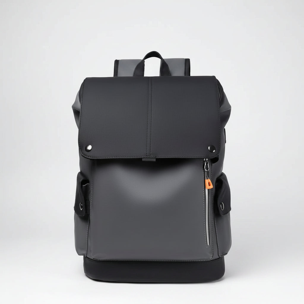 Black backpack with orange zipper pull on a white background