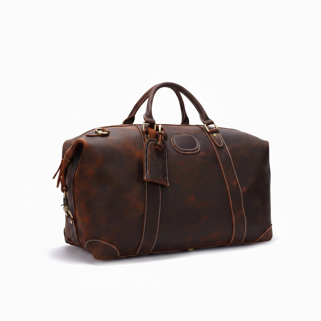 Brown leather duffel bag on a white background