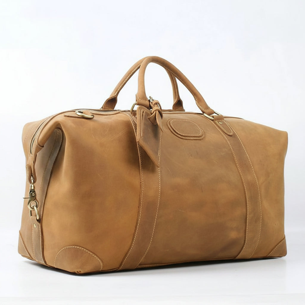 Brown leather duffel bag on a white background