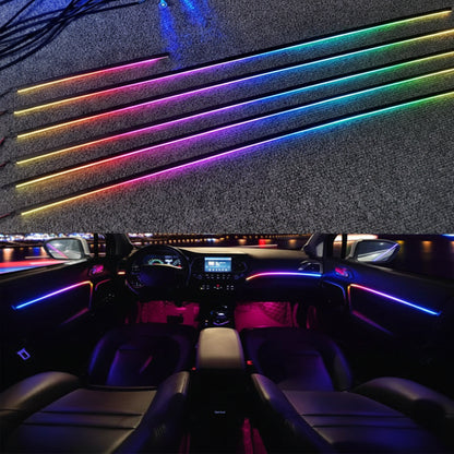 Car interior with colorful LED strip lights on a dark background