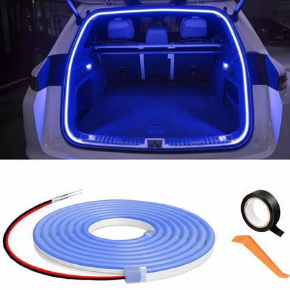 Car trunk with blue LED strip lighting and a roll of blue LED strip with accessories on a white background.