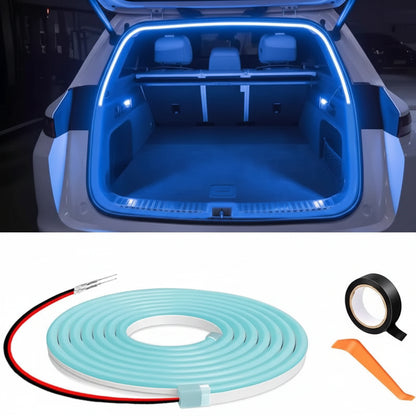 Car trunk with blue LED strip lighting, roll of ice blue LED strip, tape, and tool on a black background.