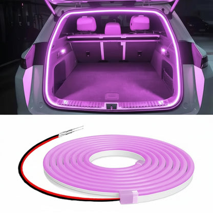 Car trunk with pink LED strip lighting and product packaging with LED strip, tape, and cutter.