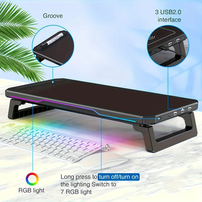 Computer monitor stand with RGB lighting and USB ports on a desk.