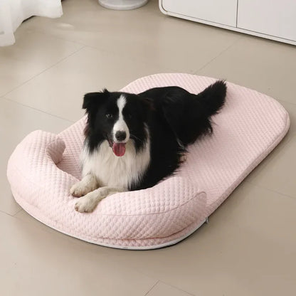 Dog lying on a pink cushioned pet bed in a room.