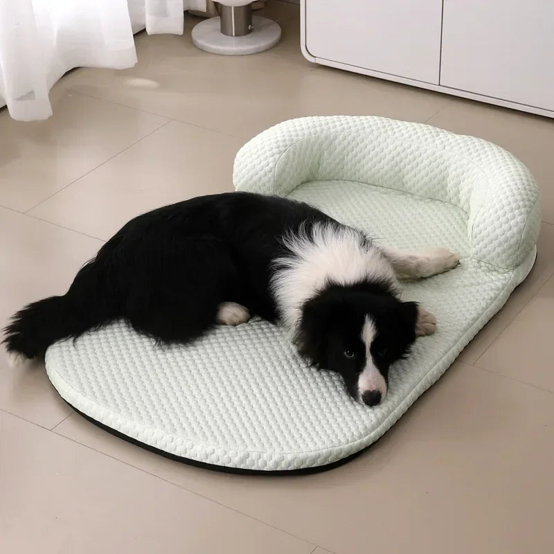 Dog lying on a textured pet bed in a room with a tiled floor.