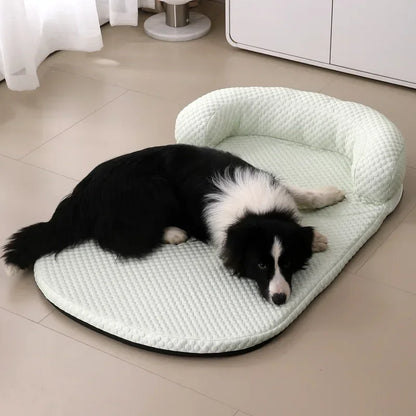 Dog lying on a textured pet bed in a room with a tiled floor.