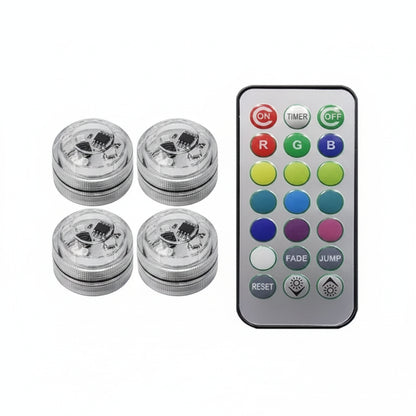 Four cylindrical light bulbs with a remote control on a white background