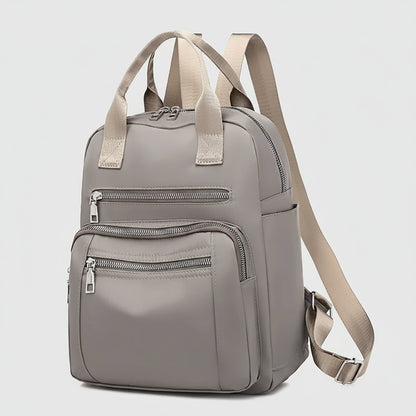 Gray backpack with beige straps on a white background