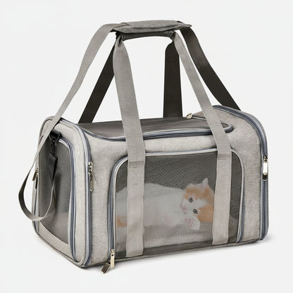 Gray pet carrier with a transparent side panel showing a small dog inside, on a white background.