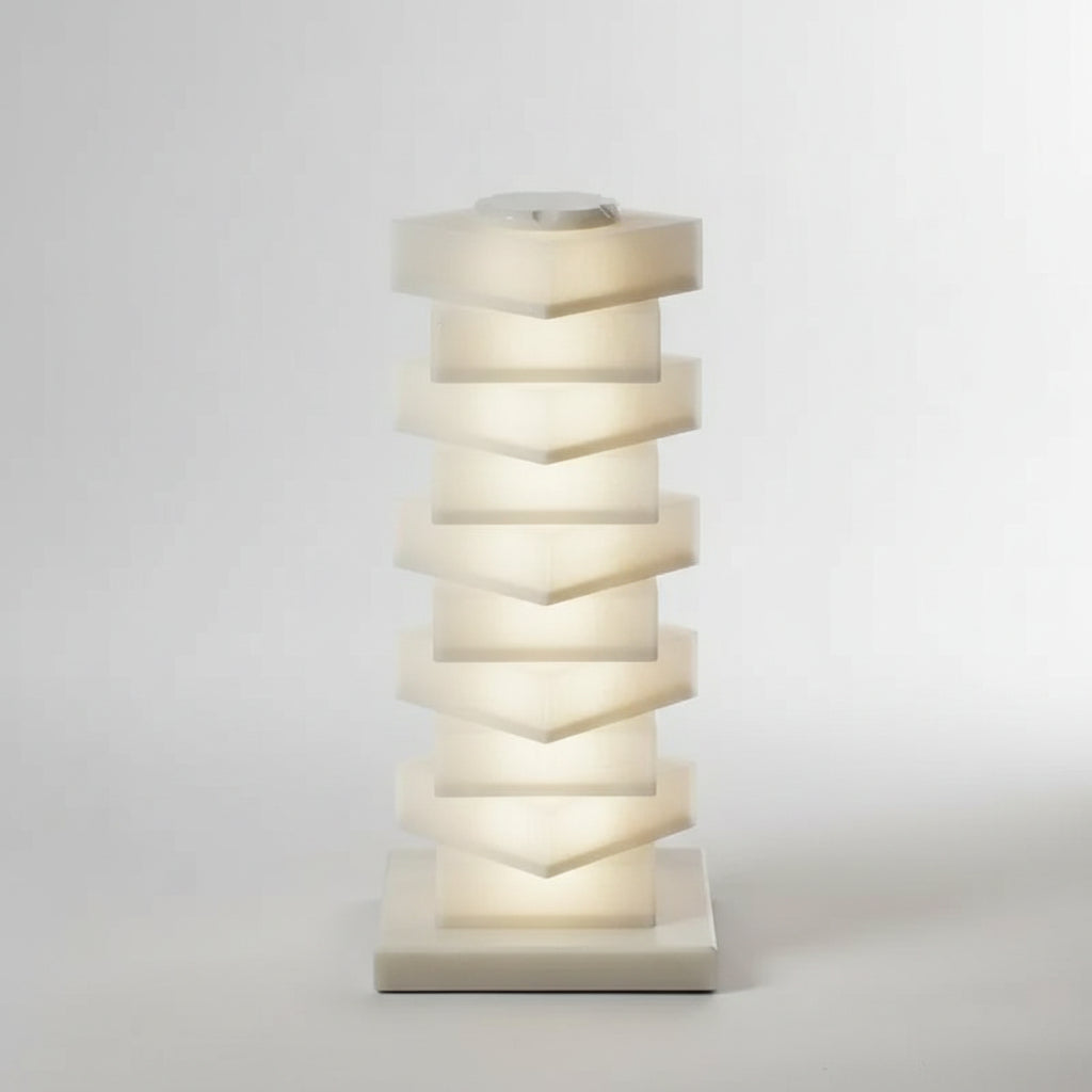 Hexagonal stack of white candles on a white background