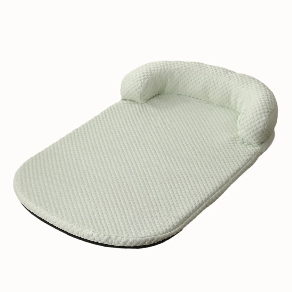 Light green baby seat with textured surface on a white background