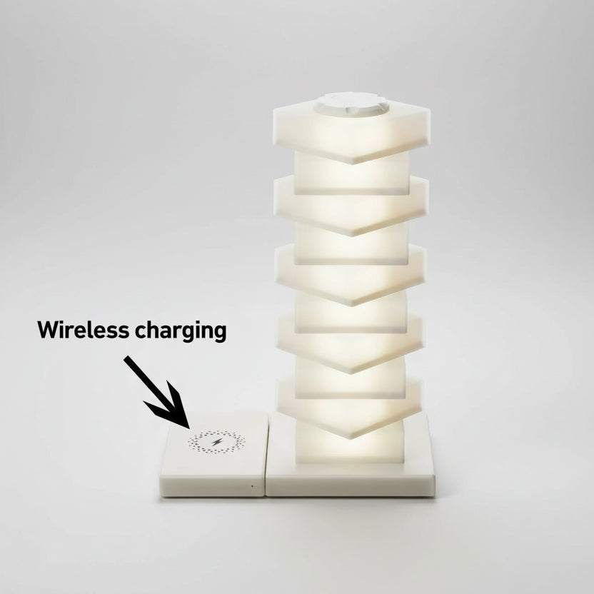 Modern table lamp with geometric design and wireless charging pad on a white background