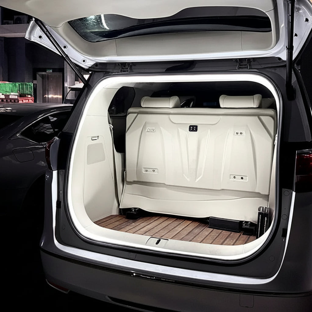 Open car trunk with white interior and wooden floor panel, showing storage capacity.