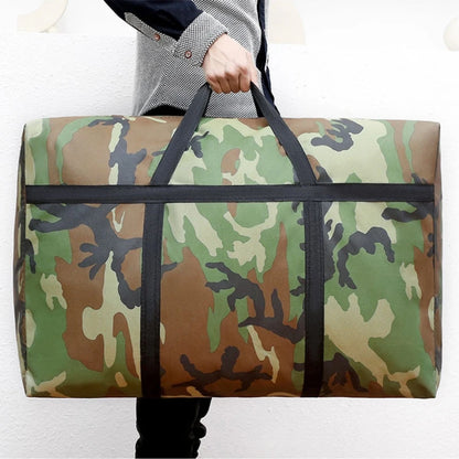 Person holding a large camouflage duffel bag against a white background