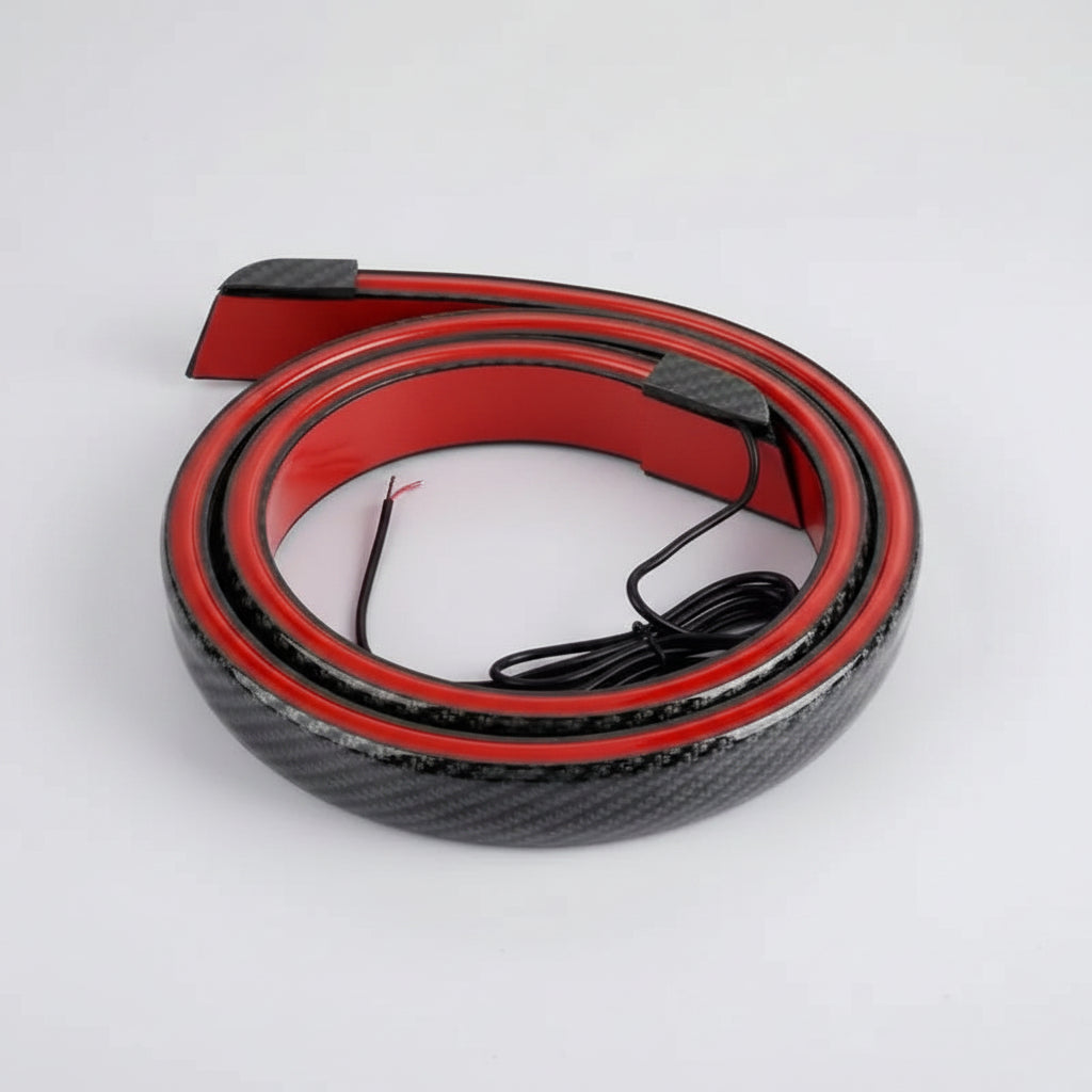 Carbon fiber patterned strip with red border and black cable on a white background
