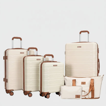 Set of cream-colored luggage with brown handles and wheels on a white background