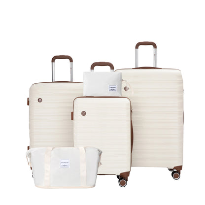 Set of cream-colored luggage with matching travel bags on a white background
