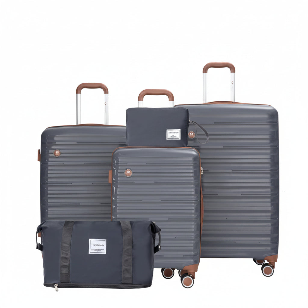Set of gray suitcases with brown handles and wheels on a white background