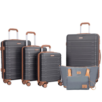 Set of gray suitcases with brown handles and wheels on a white background