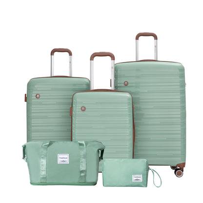 Set of green suitcases and travel bags on a white background