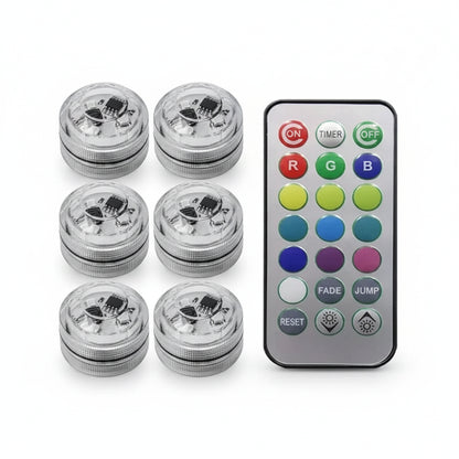 Set of six LED lights with a remote control on a white background