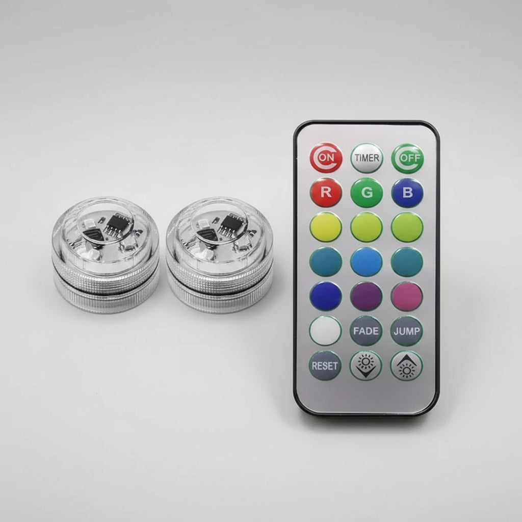 Two underwater light bulbs with a remote control on a white background