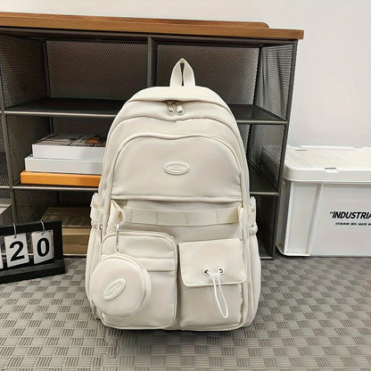 White backpack on a checkered floor with a bookshelf in the background