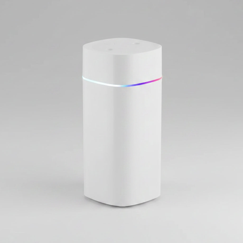 White cylindrical device with a colorful light on a white background
