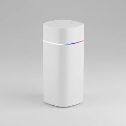 White cylindrical device with a colorful light on a white background