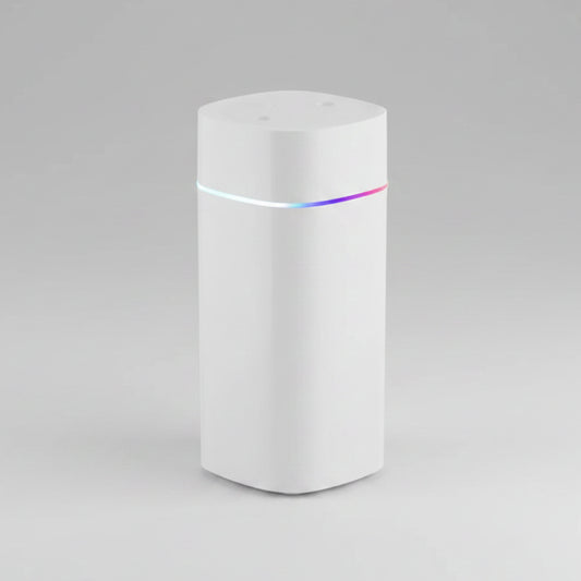 White cylindrical device with a colorful light on a white background